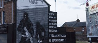 Symbole des Nordirland-Konflikts: Bild von Kriegern an einer Hauswand in Ost-Belfast wirbt für die protestantische Ulster Volunteer Force (UFV)