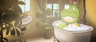 Der kleine Philosoph Knietzsche sitzt in einem grünen Monsterkostüm in einer vollen Badewanne.