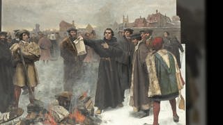 Eine Zeichnung Martin Luthers, wie er eine päpstliche Bulle verbrennt