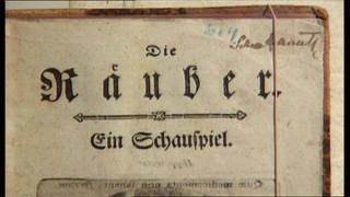 Ein vergilbtes Manuskript mit der Aufschrift "Die Räuber - Ein Schauspiel".